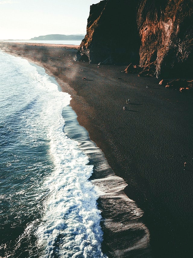 Walk on the iconic Black Sand Beach