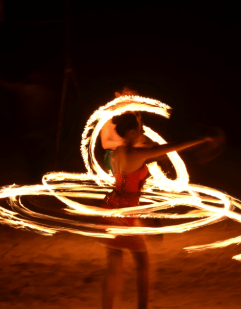 Watch a fire dance performance on the beach