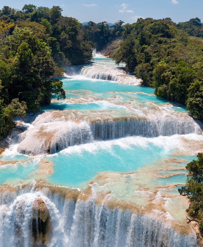 See the turquoise waters of the Agua Azul Waterfalls