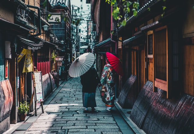Explore the narrow lamp-lit streets of Kyoto