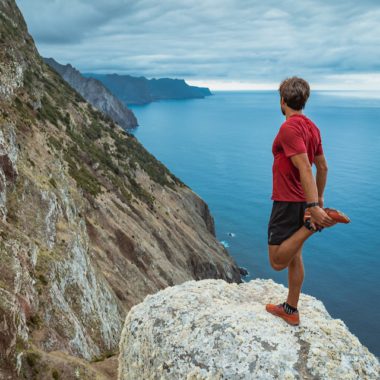 Man on cliff in Madeira, Portugal