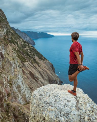 Man on cliff in Madeira, Portugal