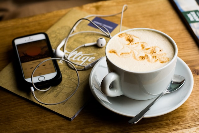 Coffee and phone with headphones