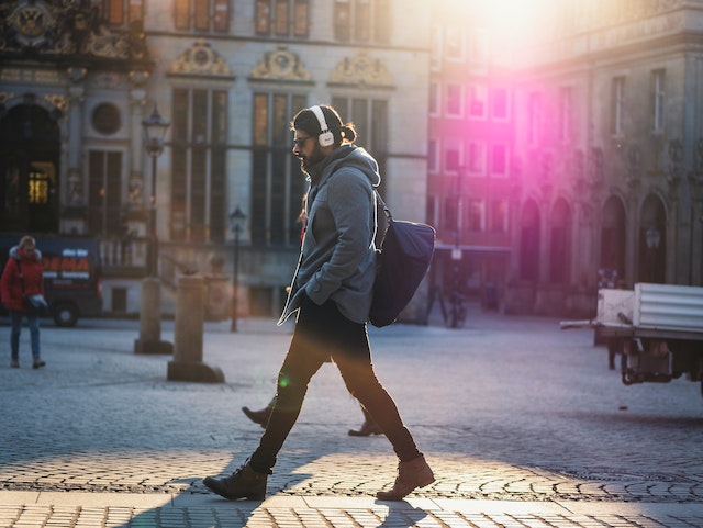 Man walking on cobblestones