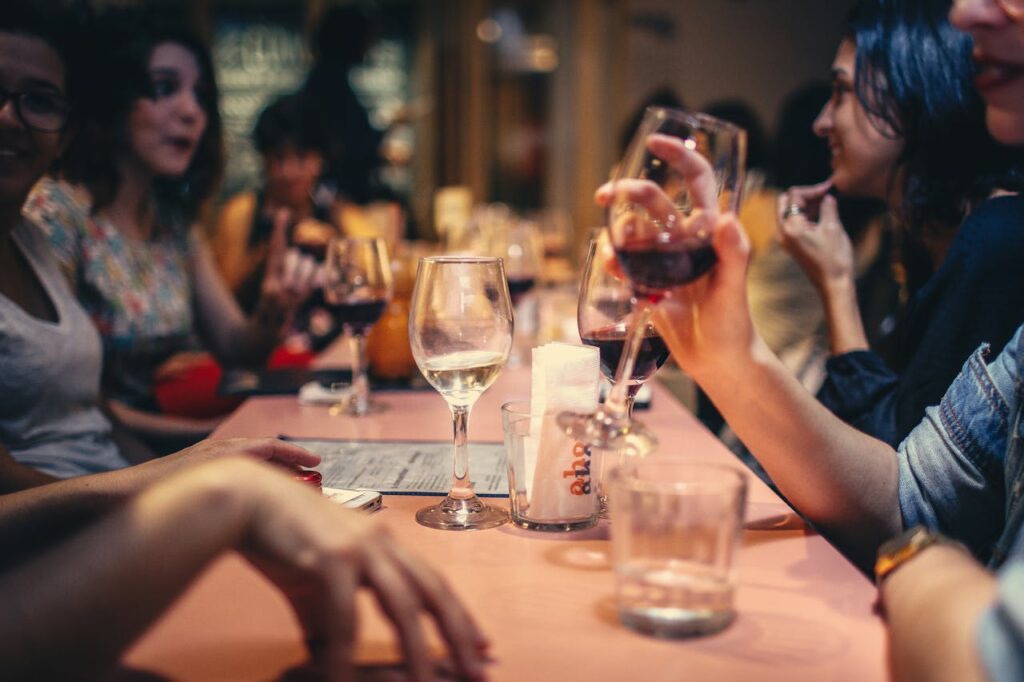 Group of people drinking wine at table